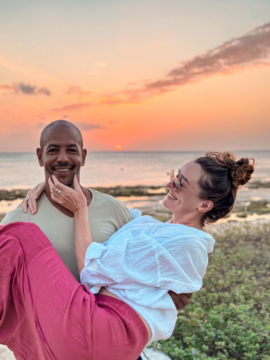 Couple enjoying sunset during a trip to Rote Island, Indonesia