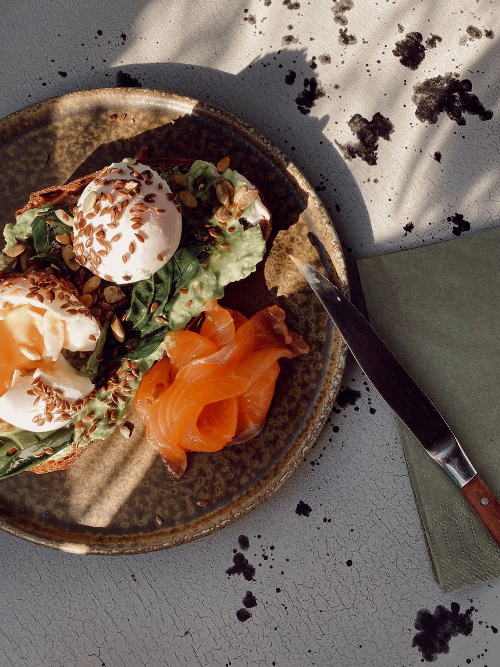 Brunch with smoked salmon and eggs at a café in Rote Island