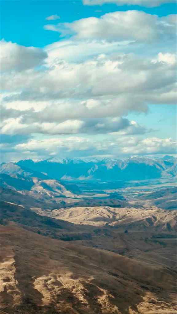 Wide mountain and valley view from Crown Range Road above the Queenstown region.