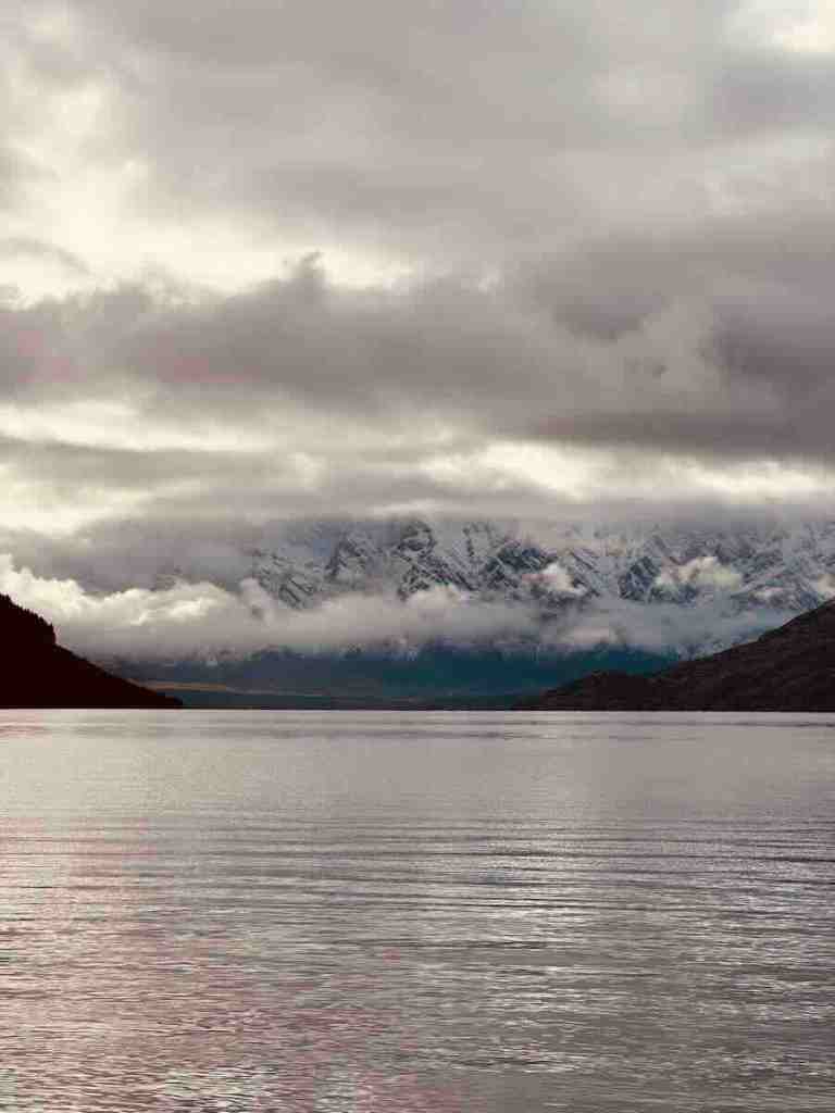 Moody view across Lake Wakatipu toward cloud-covered mountains on the Glenorchy drive.