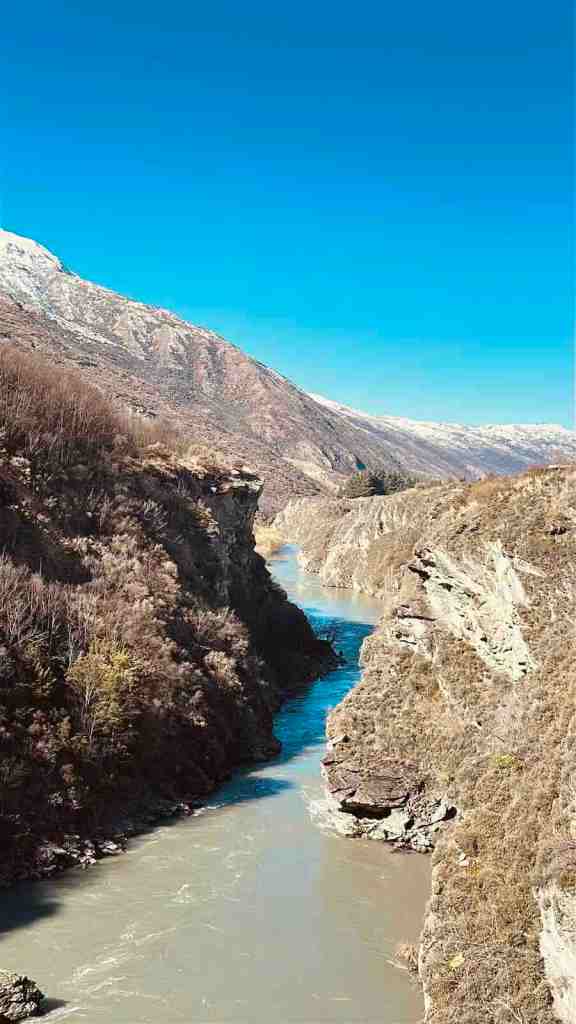 Turquoise Kawarau River flowing between steep rocky cliffs in Central Otago.
