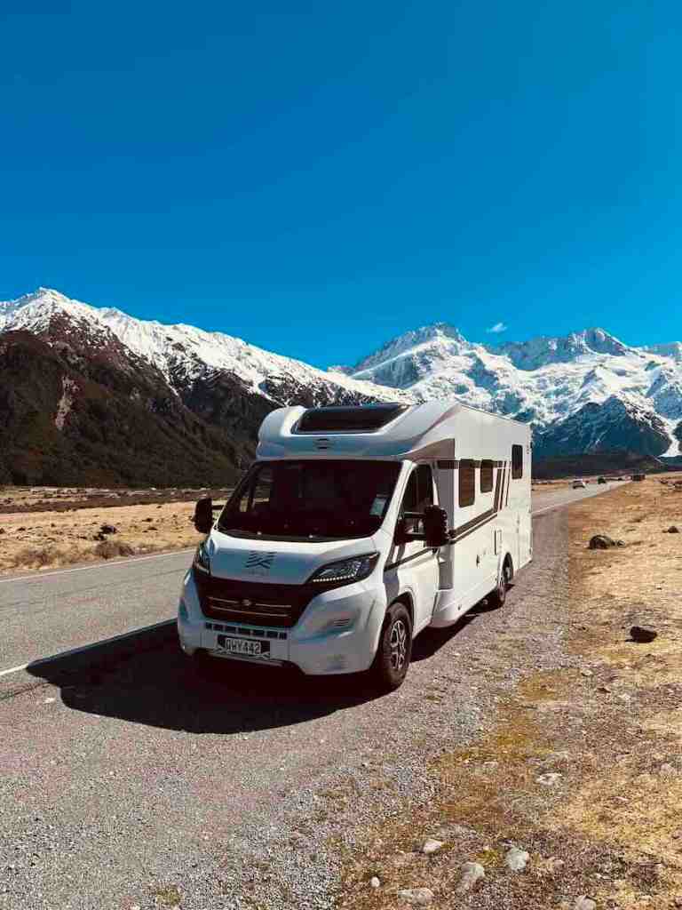 Our Wilderness Motorhomes campervan parked among the mountains during our 10-day New Zealand South Island road trip.
