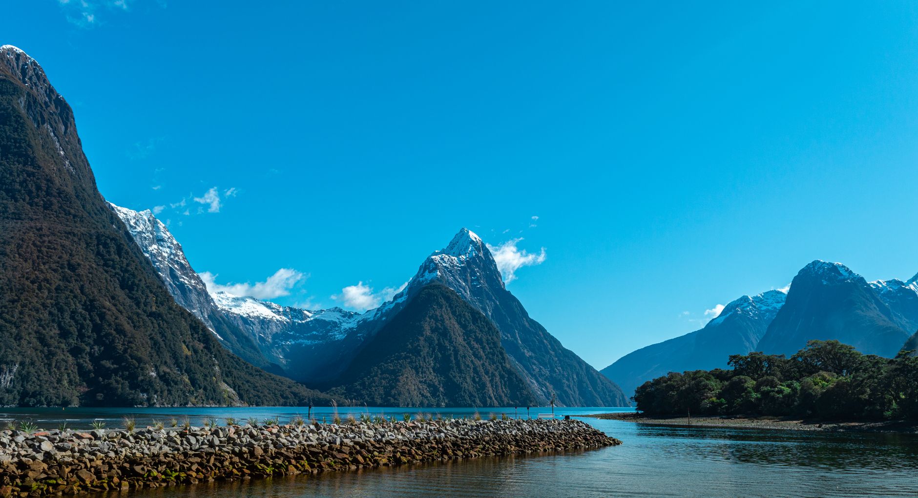 Mitre Peak rising above the blue water of Milford Sound in Fiordland National Park.